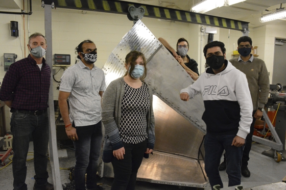 Physics professor Garth Huber (left) and his student team are constructing part of the Solenoidal Large Intensity Device that will be housed at the Jefferson Lab in Virginia.  (Students left to right: Vijay Kumar, PhD physics student, Emma Kirby, undergraduate physics Co-Op student, Stephen Kay, postdoctoral Fellow, Ali Usman, PhD physics student, Muhammad Junaid, PhD physics student. 